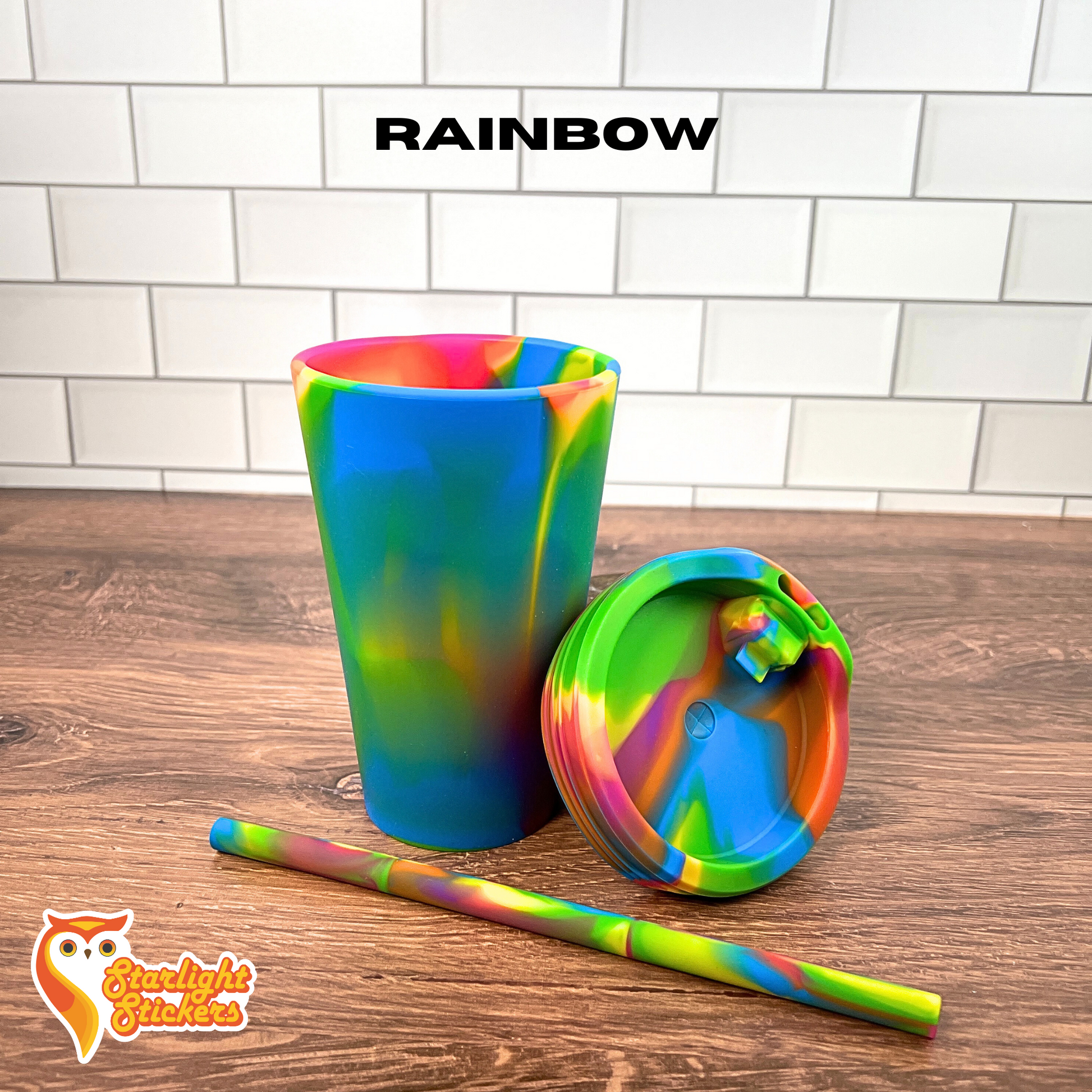 Rainbow silicone cup on a wooden table.