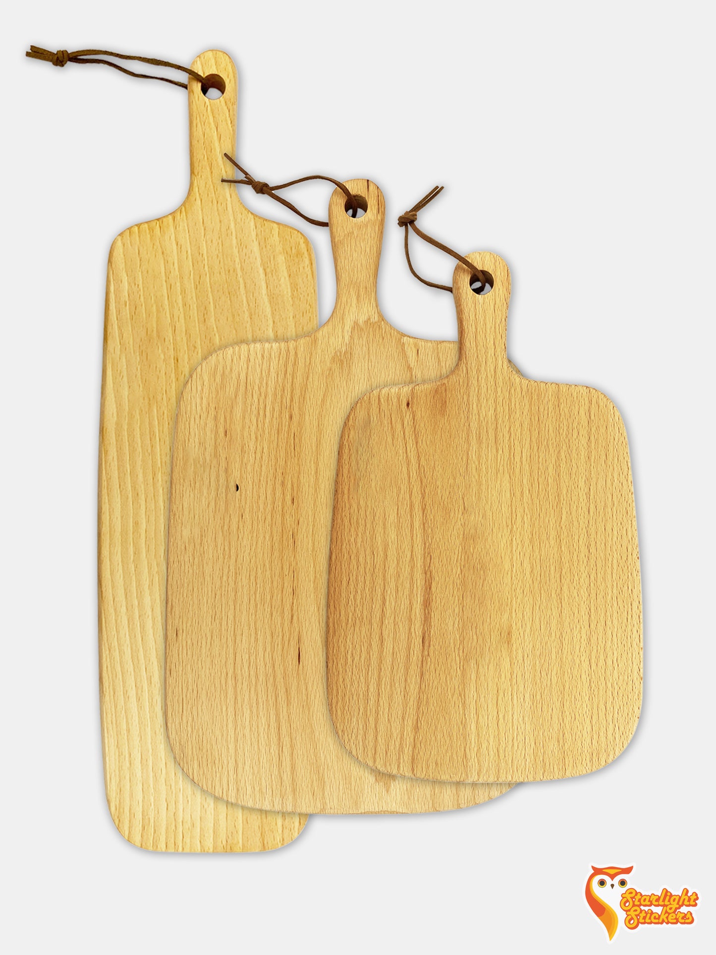 Three cutting boards overlapping each other on a white background.