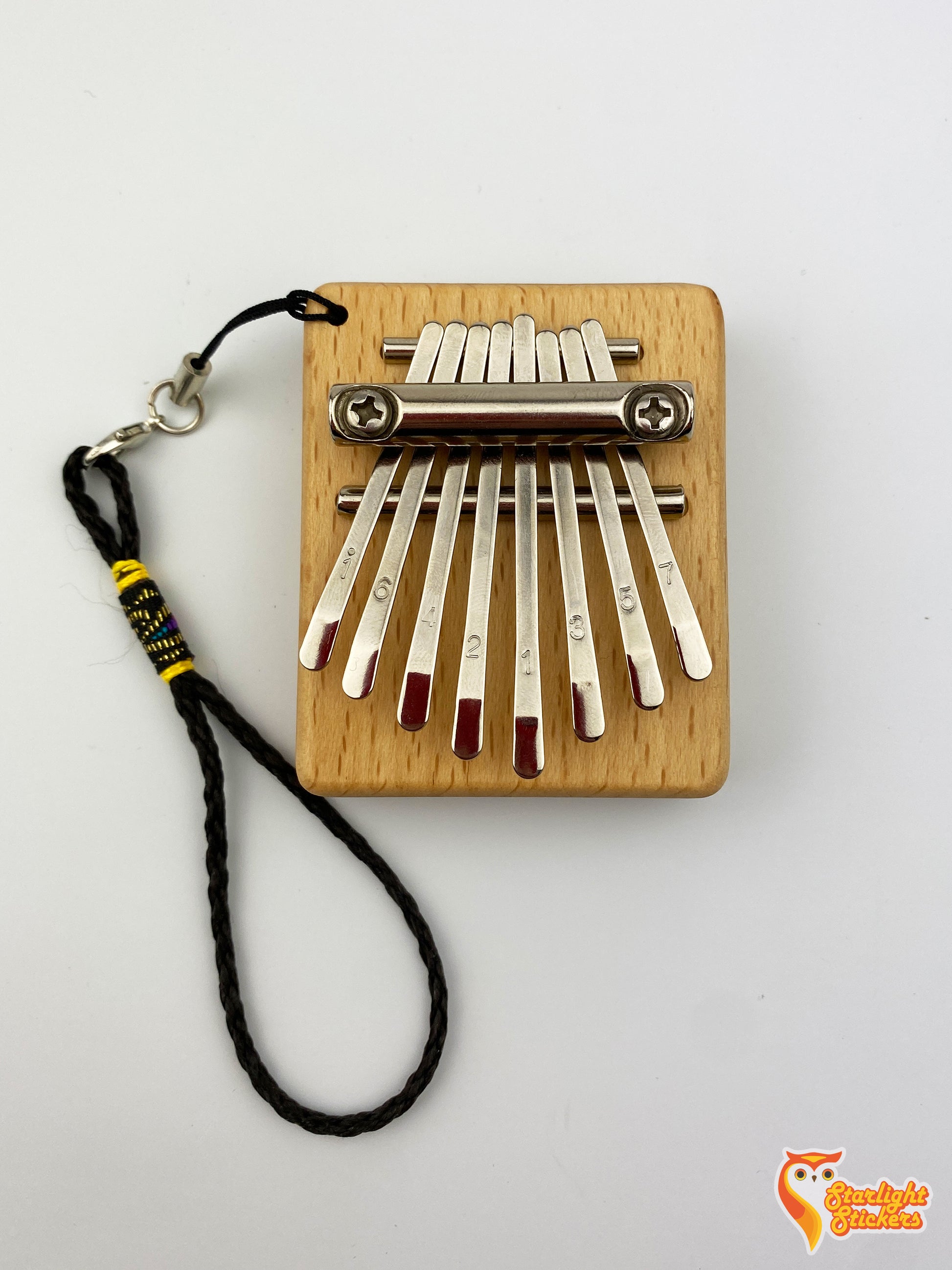 Front view of the pocket kalimba with the key chain attached.