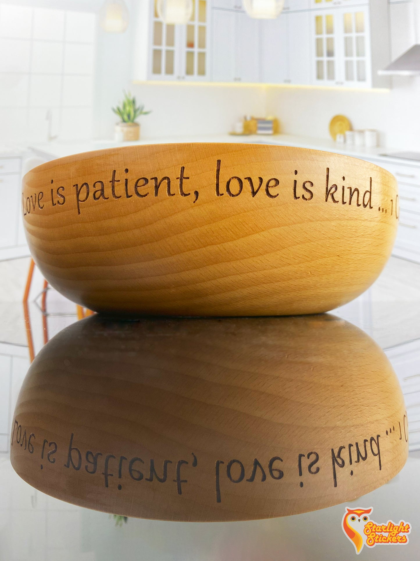 Engraved wooden bowl stating; "love is patient, love is kind"