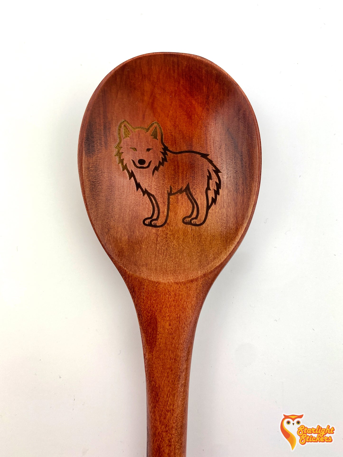 Engraved spoon of a wolf.