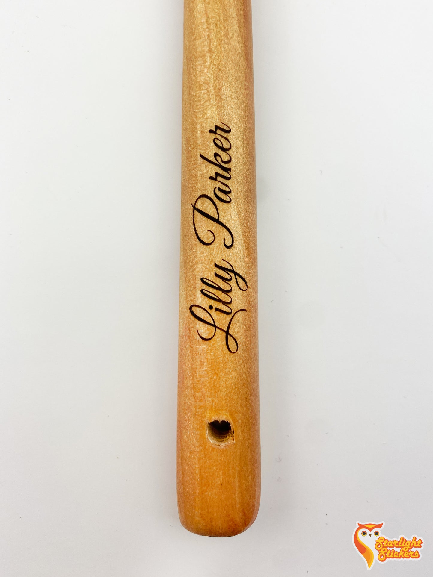 Engraved light wood handle with the name, Lilly Parker.