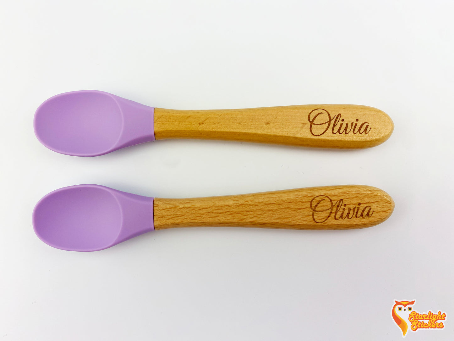Two spoons with the name, Olivia, engraved into each handle.