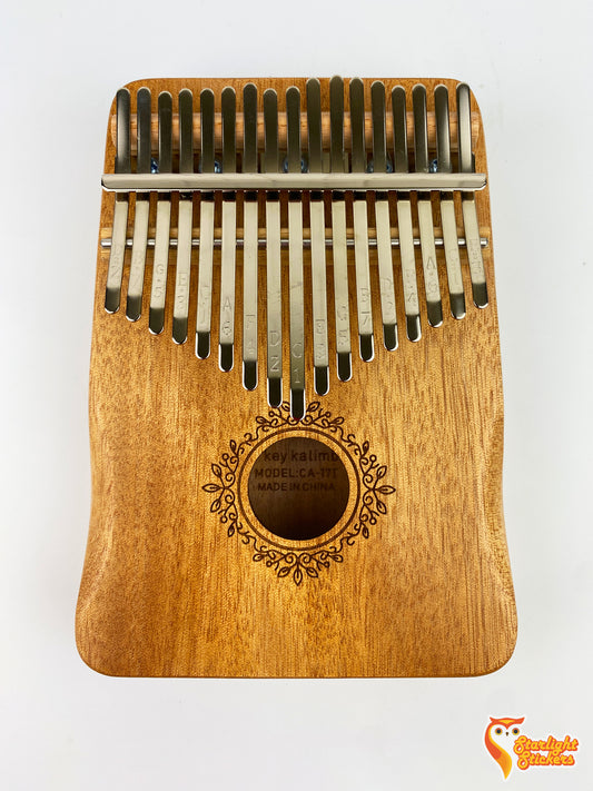 Front view of a kalimba on a white background.