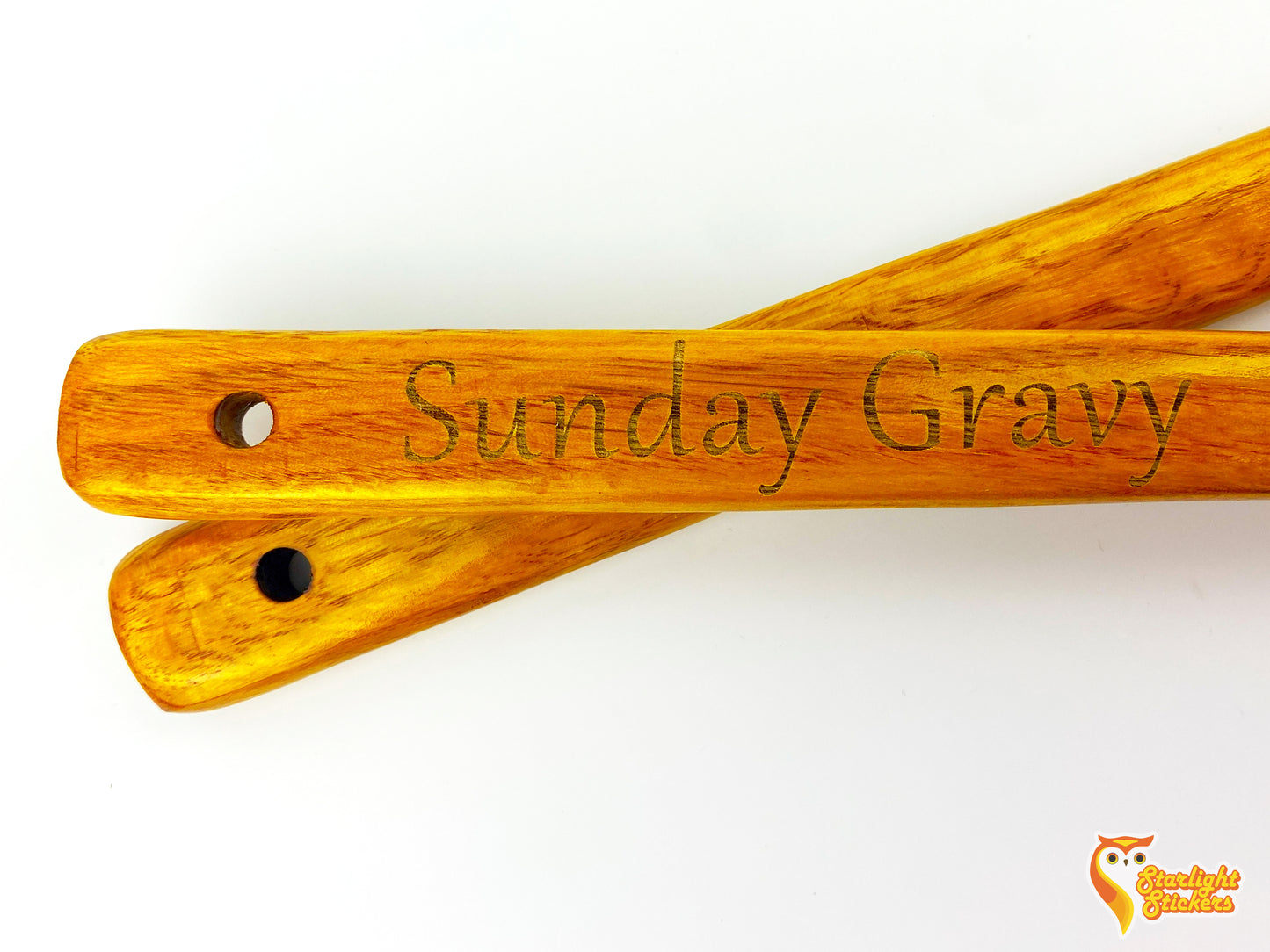 Two engraved spoon handles