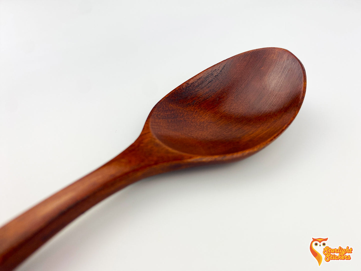 Close up of the dark wood spoon.