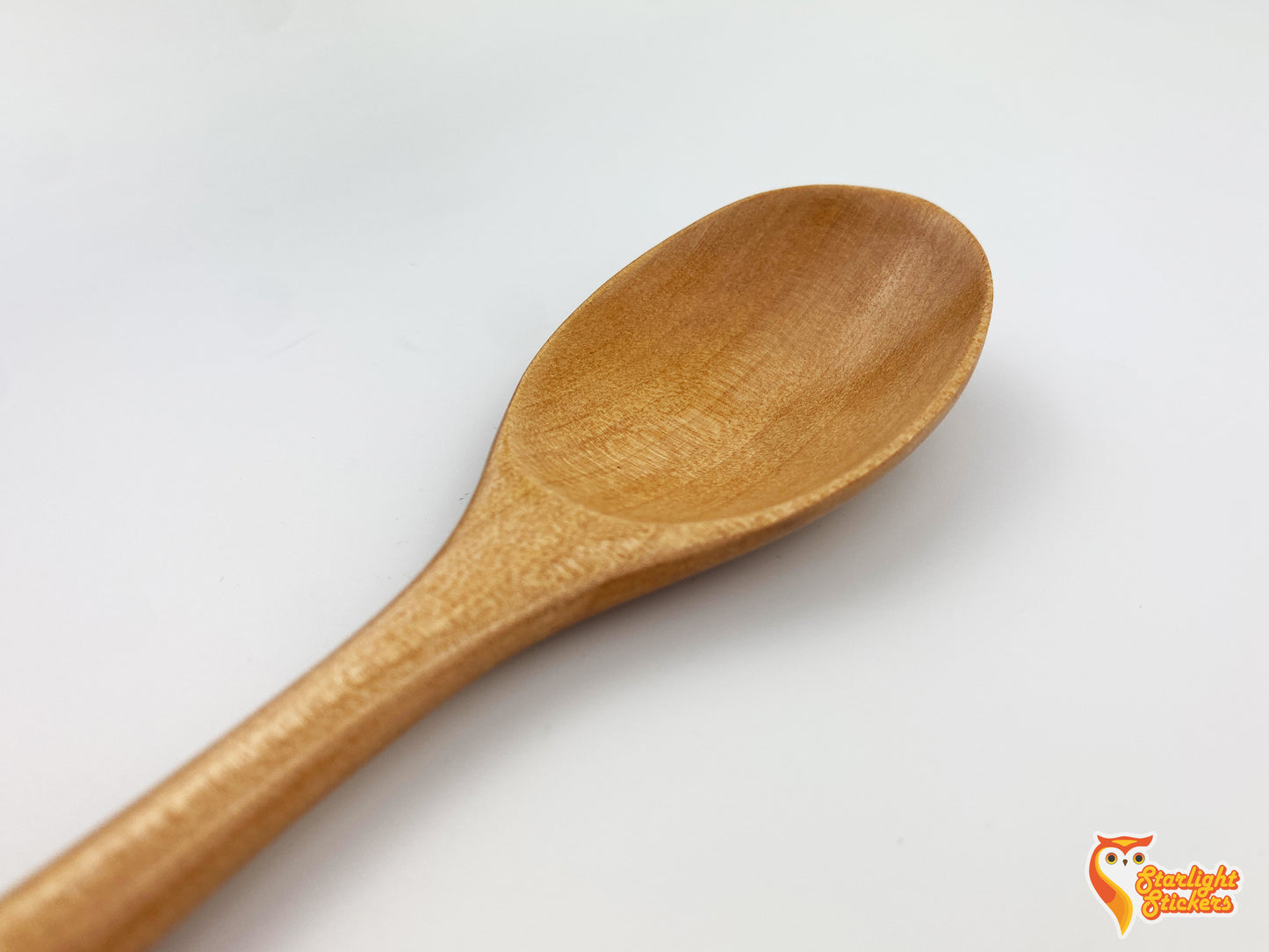 Close up of a light wood spoon.