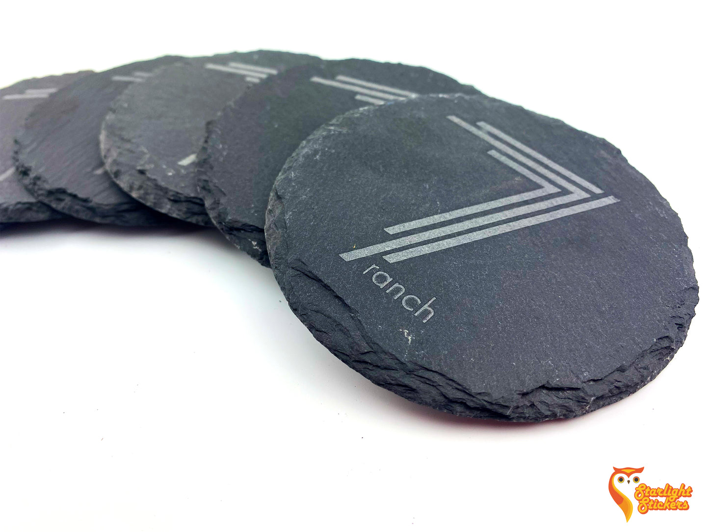 Circle coasters spread out on a white table, featuring a 7 ranch logo.