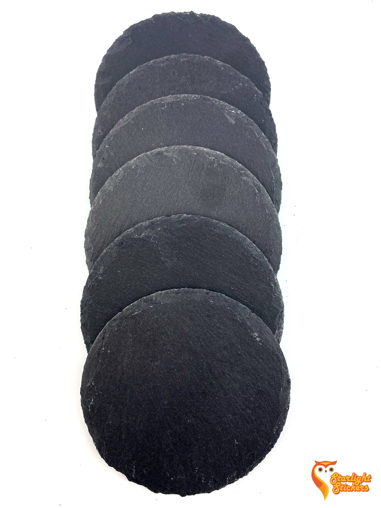 6 circular coasters overlapping in a vertical line on a white table.