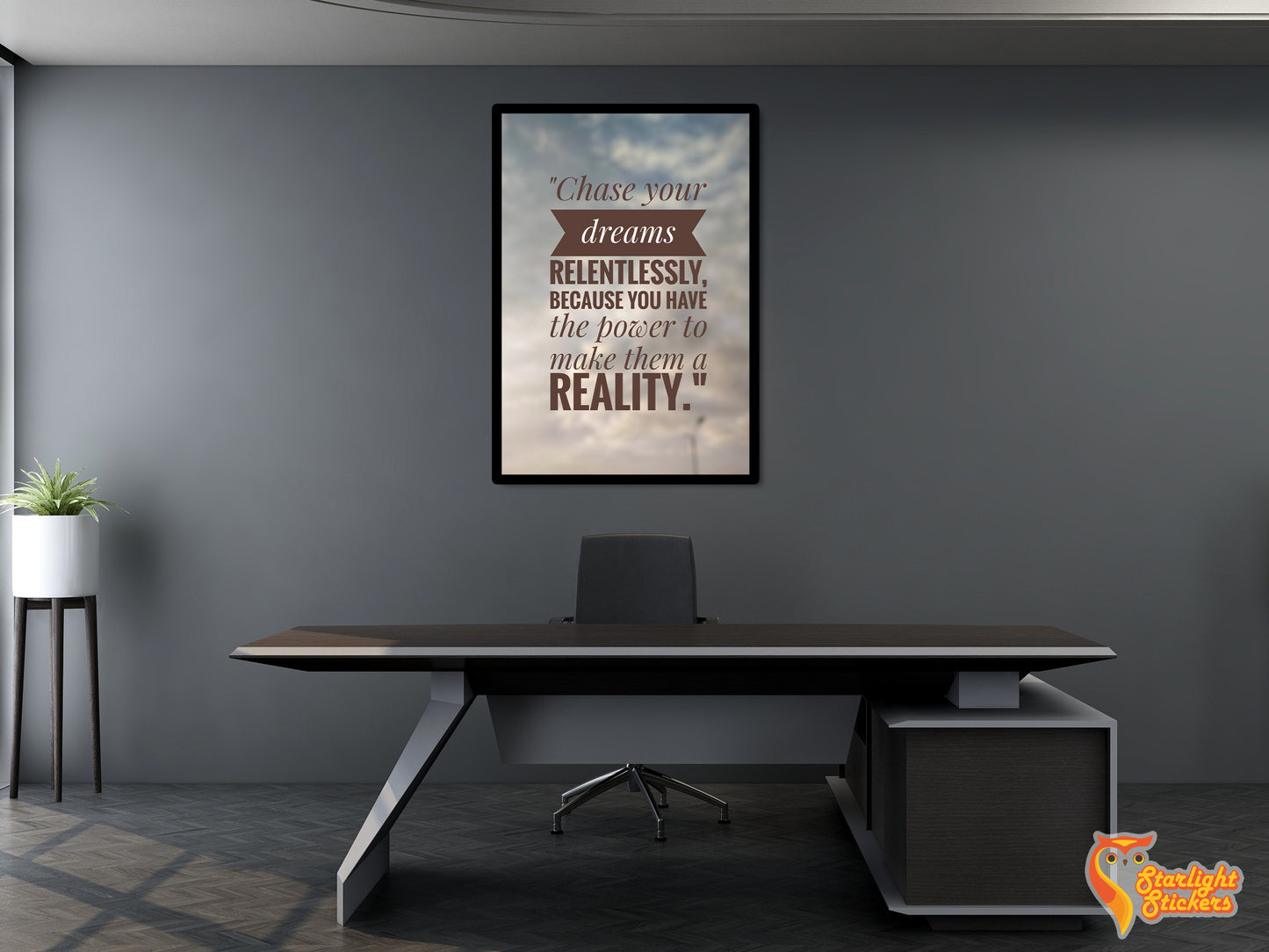 Poster of a motivational quote above a work desk.