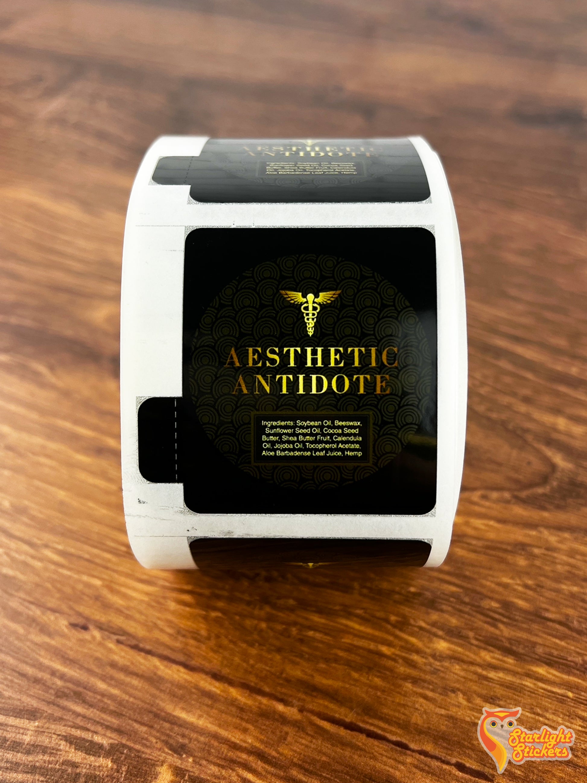 Label roll, featuring a company called Aesthetic Antidote with black and gold coloring.