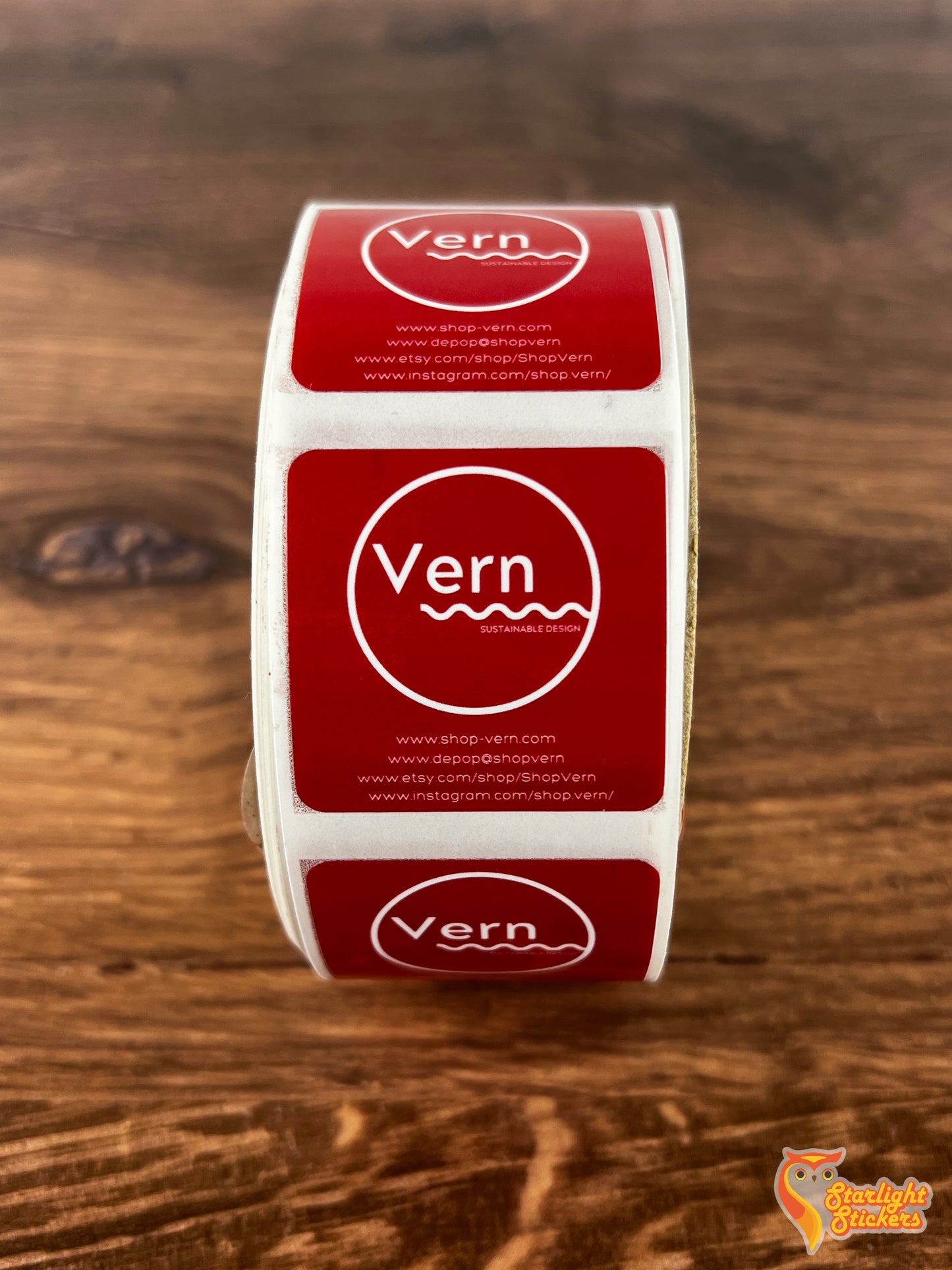 Square label roll, featuring "Vern" logo on a wooden table.