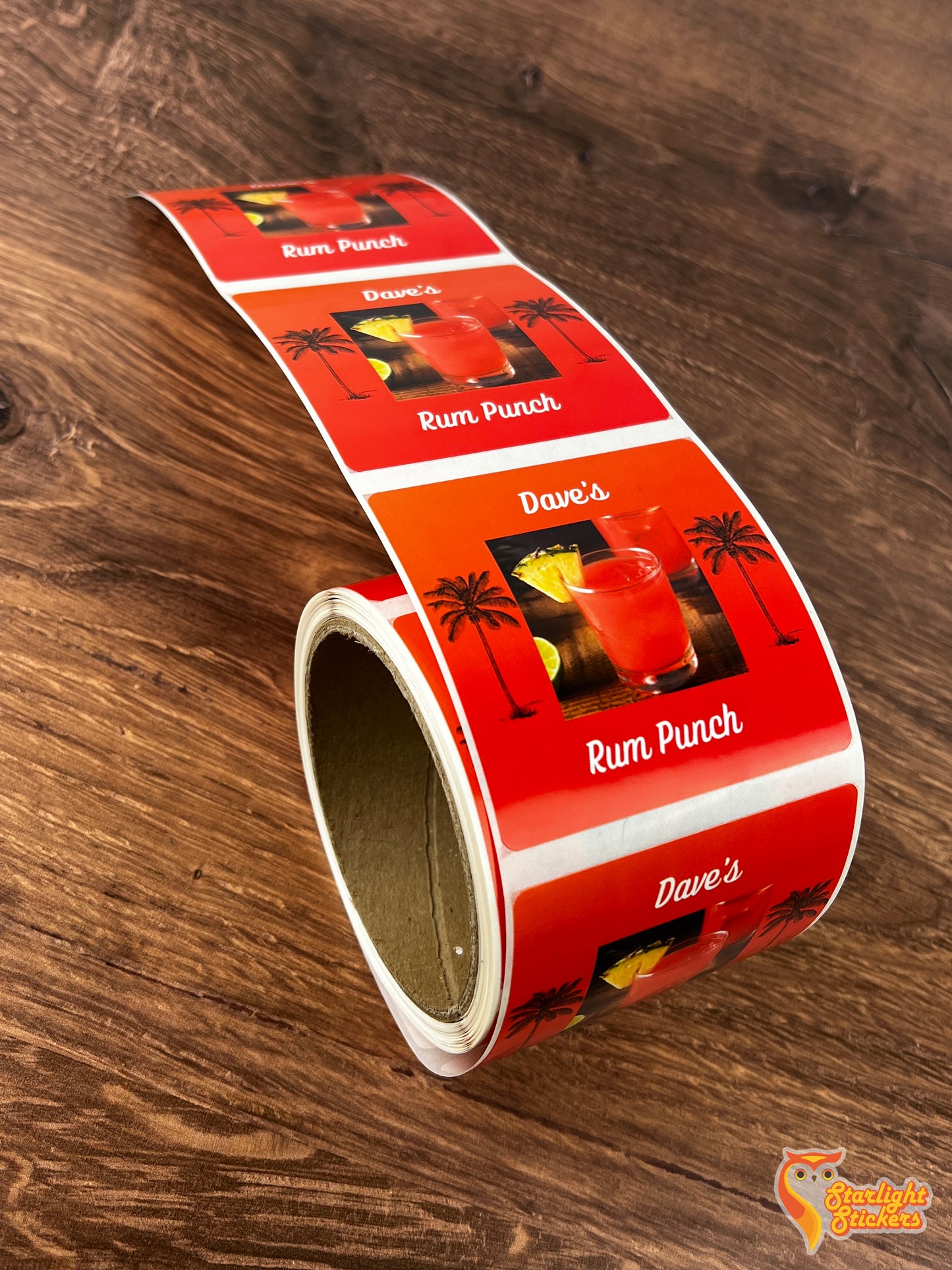 Square label roll, featuring "Dave's Rum Punch" logo on a wooden table.