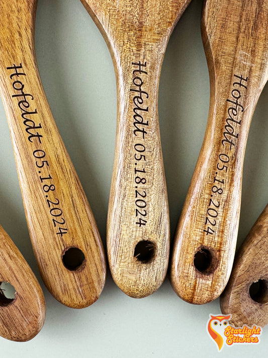 Close up of the engraved handles of 3 spurtles.