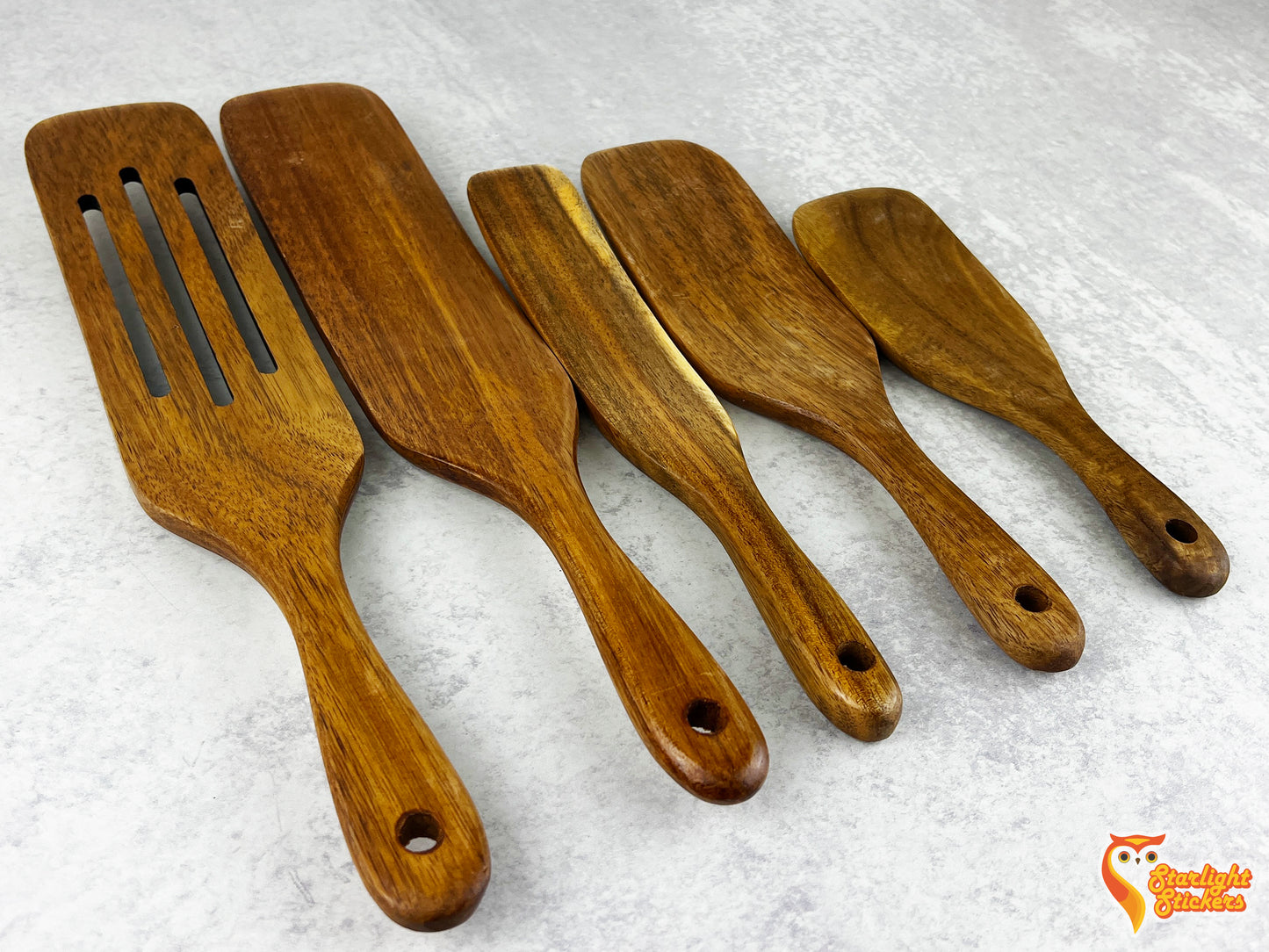 A spurtle set lined up next to each other.