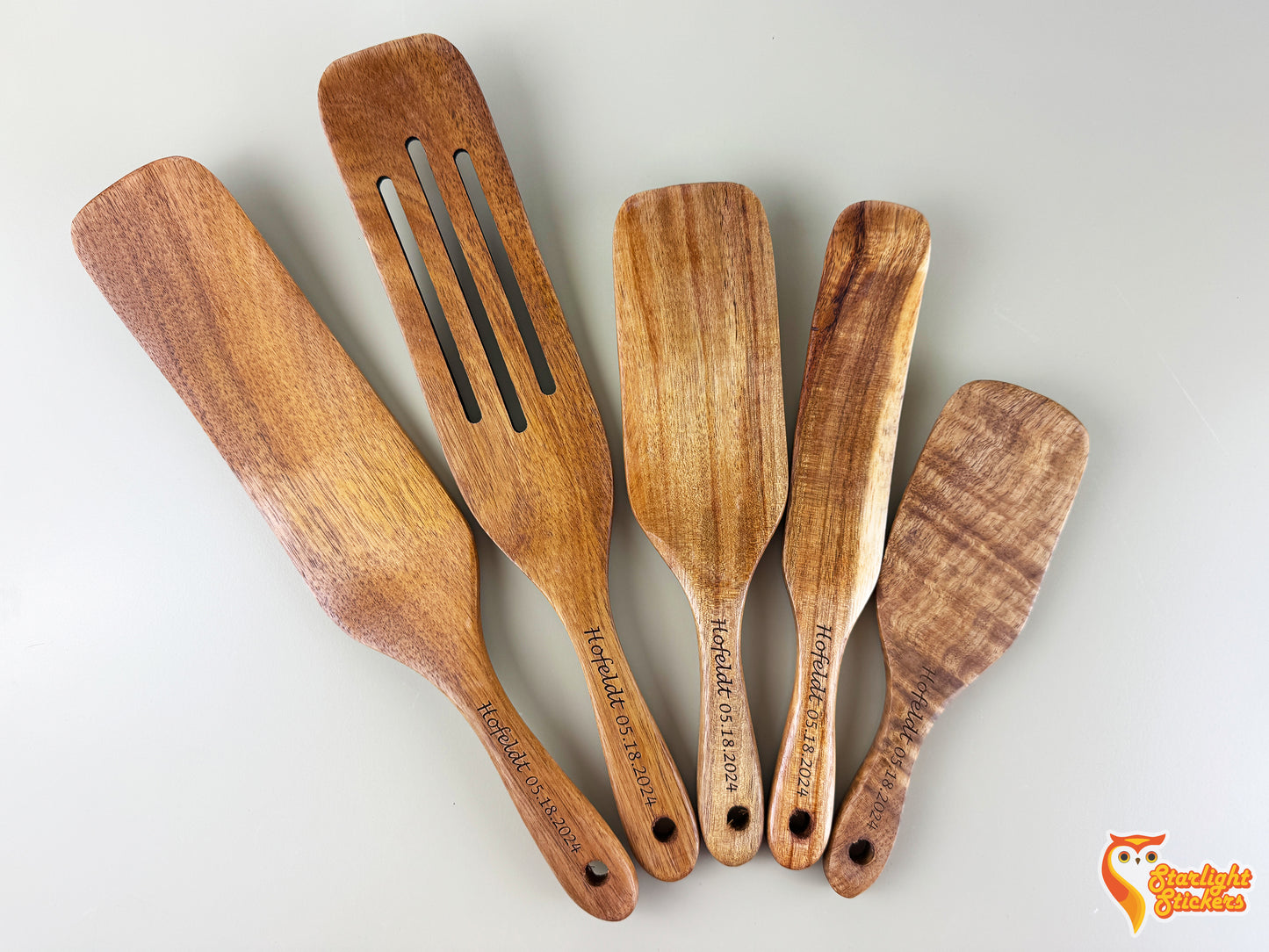 A spurtle set with a white background.