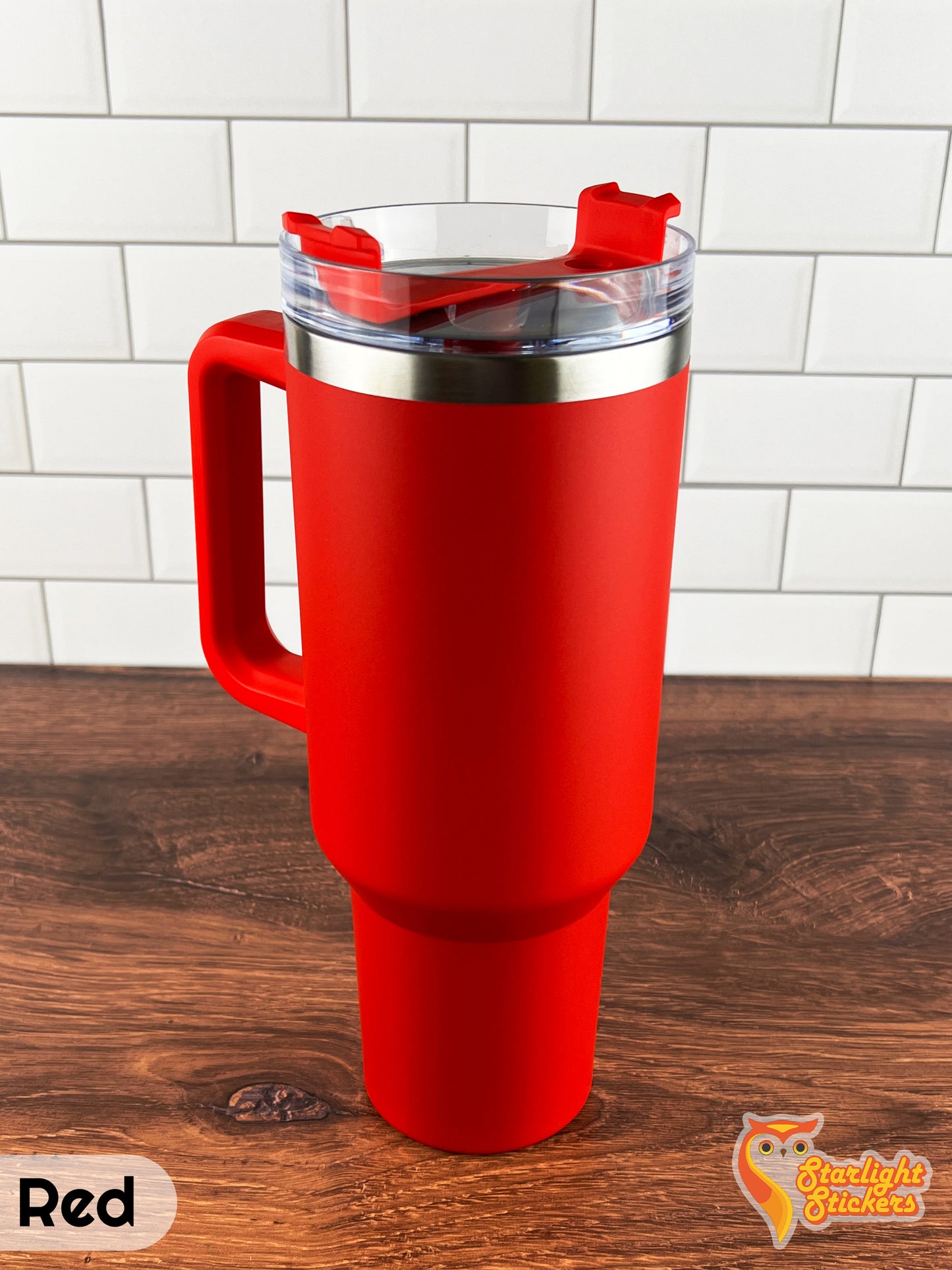 Red tumbler on a wooden table.