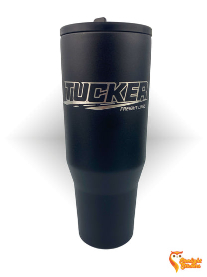 Black tumbler with "Tucker Freight Lines" engraved. 