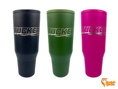 Black, olive green, and pink tumblers next to each other with a white background. 