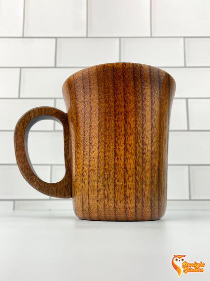 Plain wooden mug with a white tile background. 