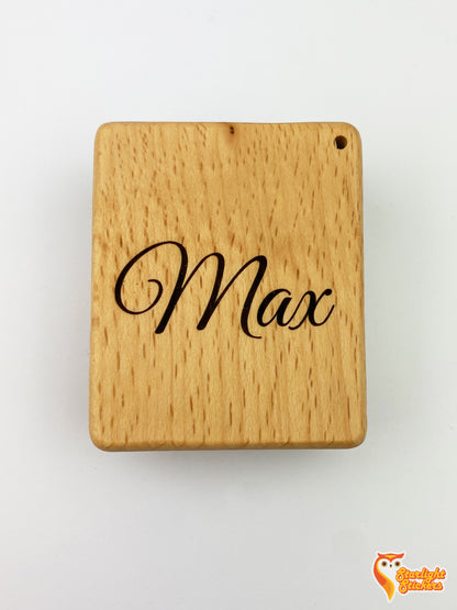 Pocket kalimba with the name, Max, engraved in it. 