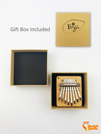 Image of the pocket kalimba in its packaging gift box. 