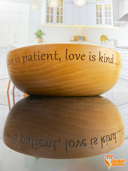 Engraved wooden bowl stating; "love is patient, love is kind" 