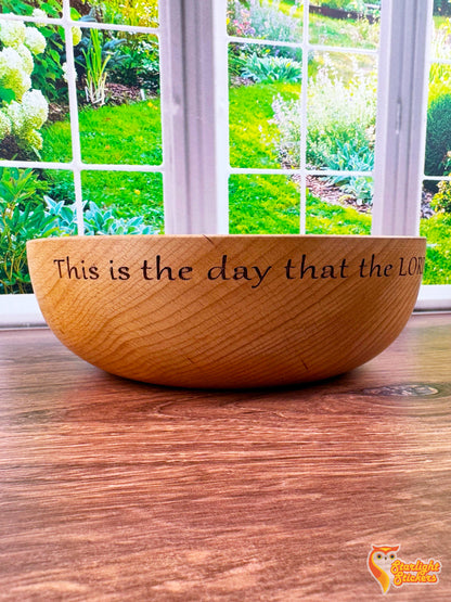 Engraved wooden bowl on a wooden table. 