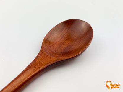 Close up of dark wood spoon. 