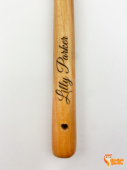 Engraved light wood handle with the name, Lilly Parker. 