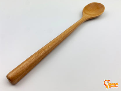 Close up of a light wood spoon handle. 