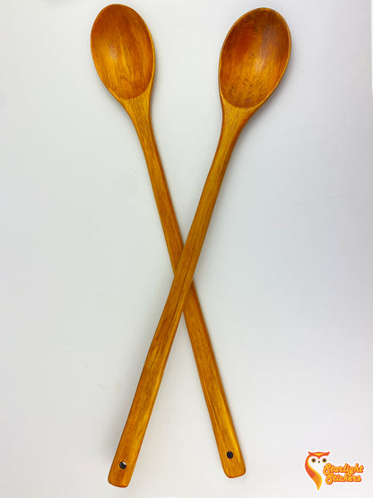 2 spoons making an "X" on a white table