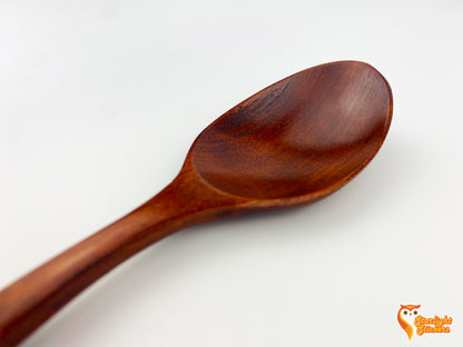 Close up of the dark wood spoon. 