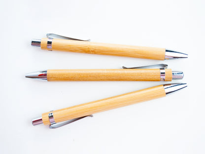 Three blank wooden pens with white background