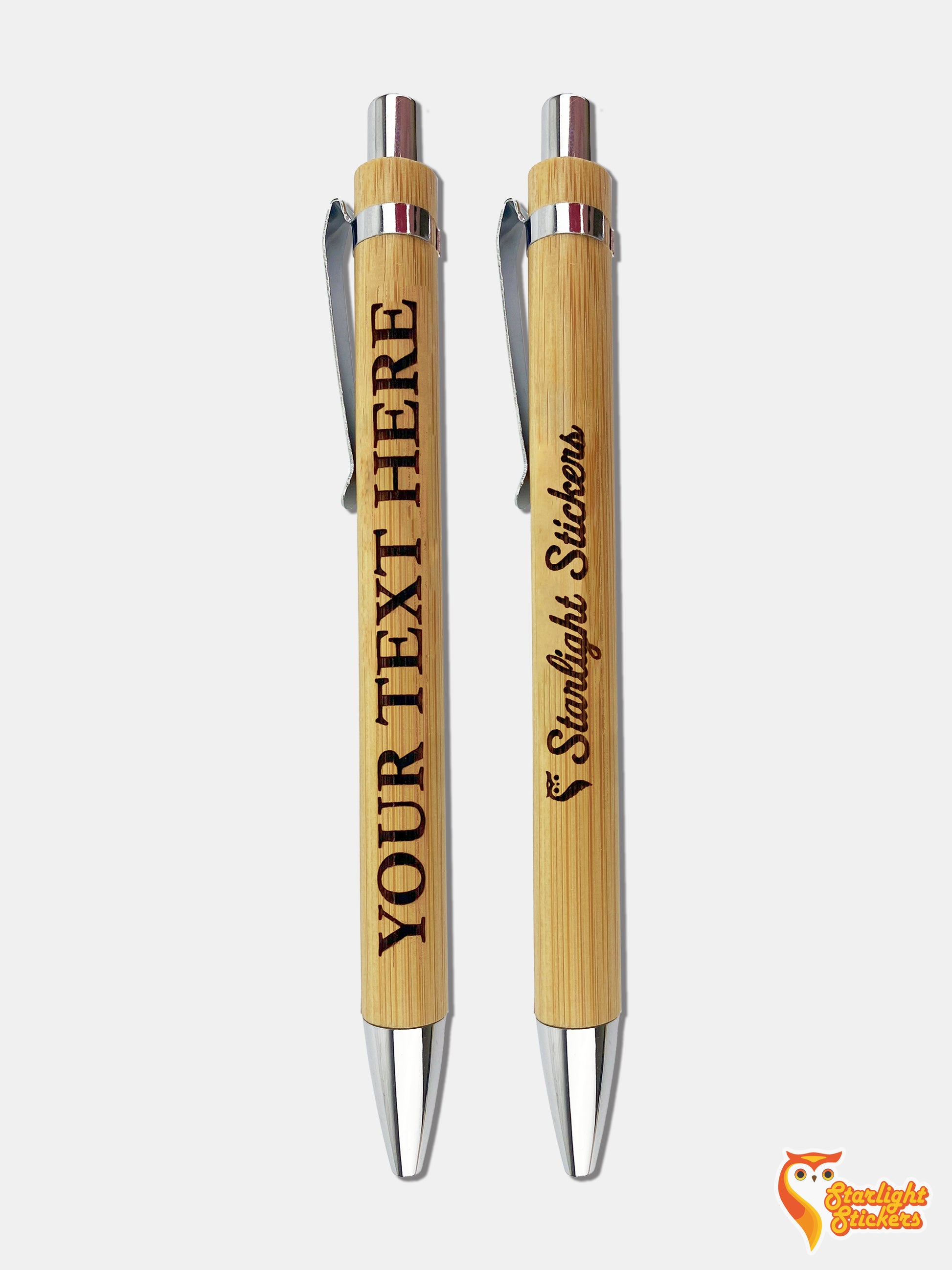 Two wooden pens with engraved text saying "Your Text Here" and "Starlight Stickers"