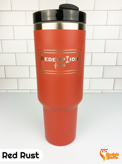Red rust tumbler with engraving. 